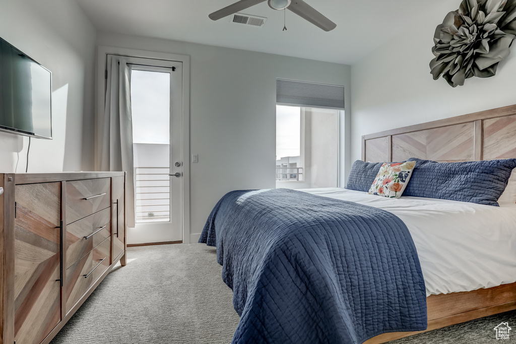 Bedroom with carpet, a ceiling fan, and baseboards