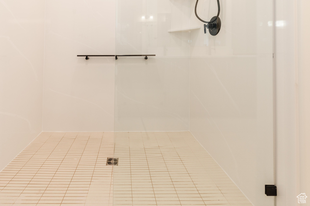 Bathroom featuring tile patterned floors and a shower