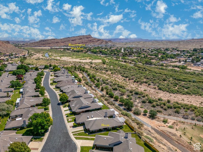 Aerial perspective of suburban area with a mountain backdrop