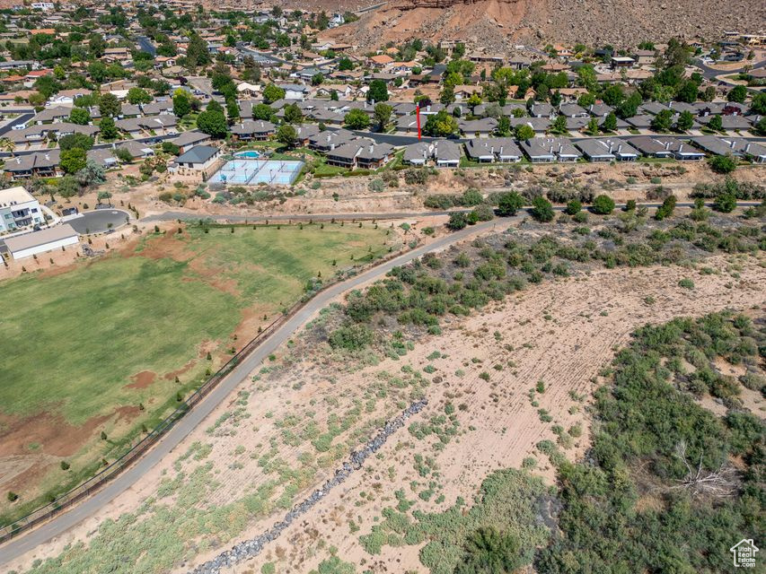 Aerial overview of property's location featuring nearby suburban area