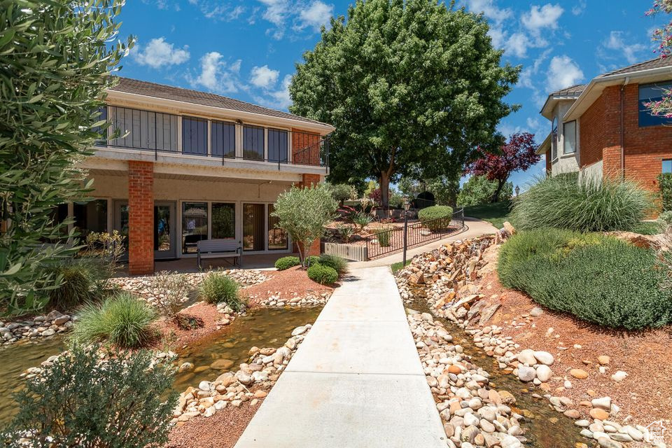 View of yard featuring a balcony and a patio area
