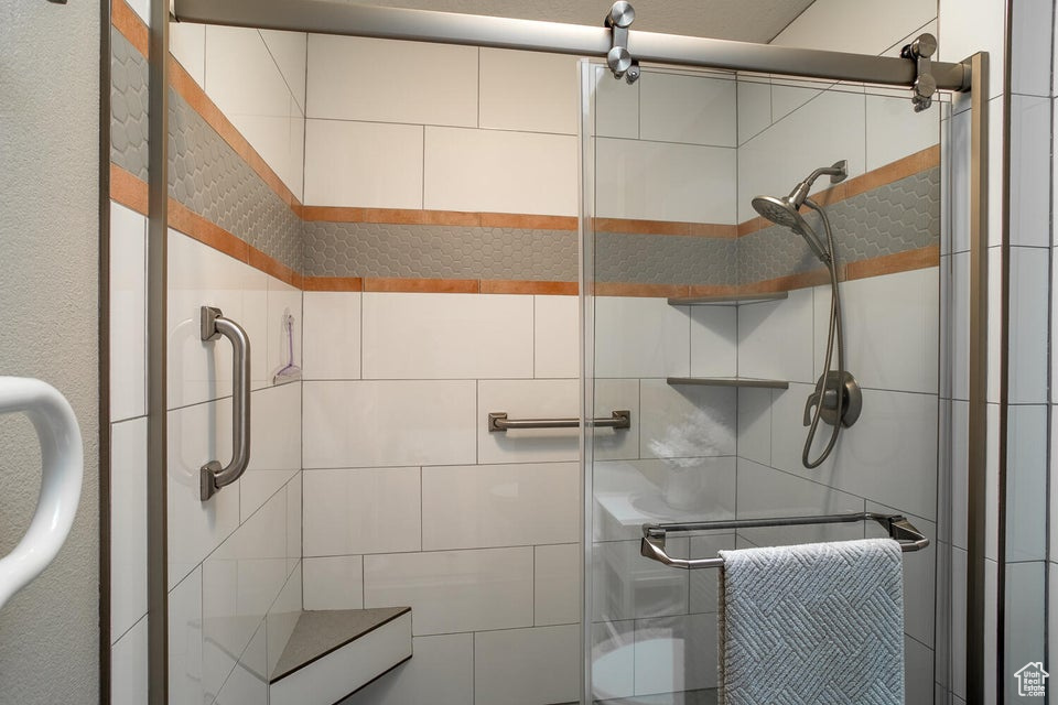 Full bathroom featuring a stall shower