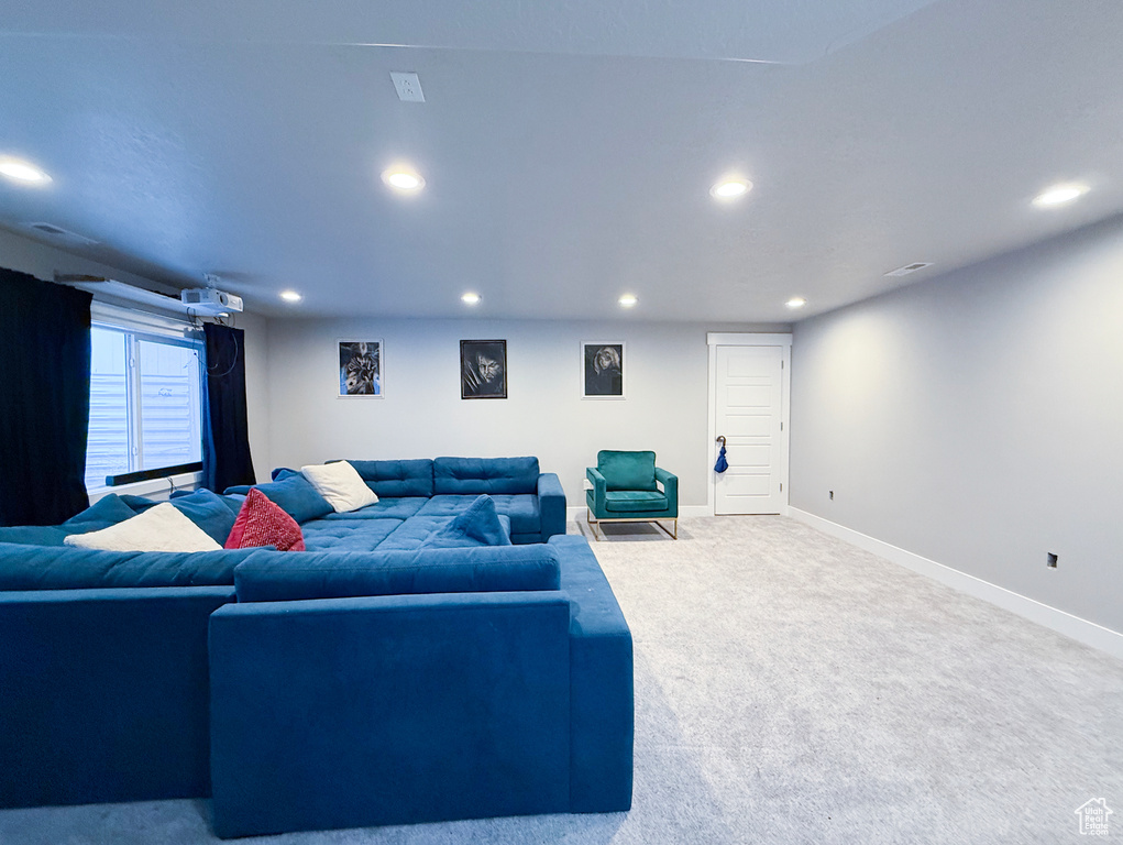 Living room featuring recessed lighting, carpet floors, and baseboards