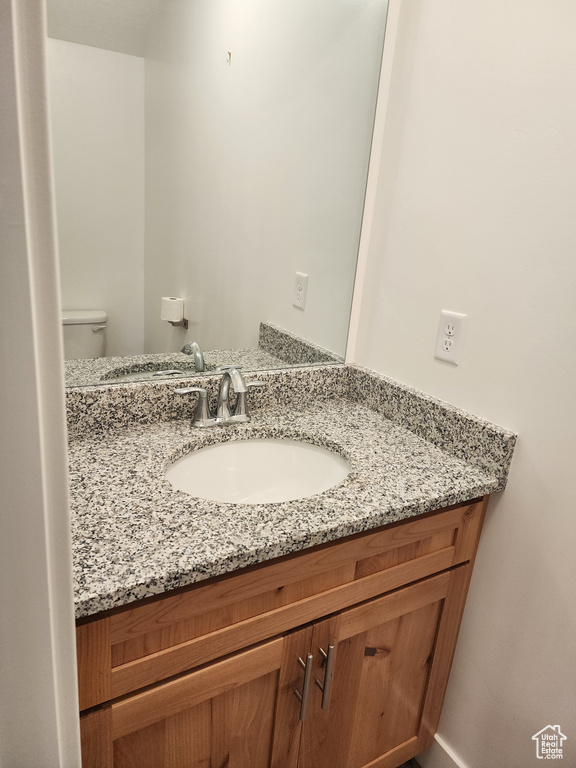 Bathroom with vanity and toilet