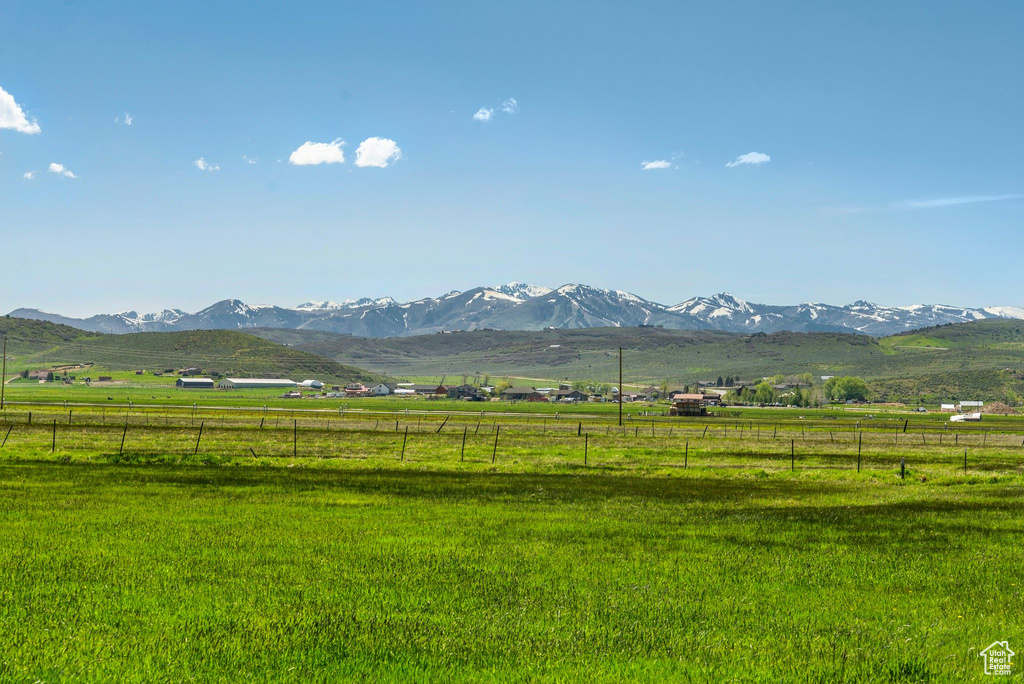 View of mountain background with rural landscape and agricultural land