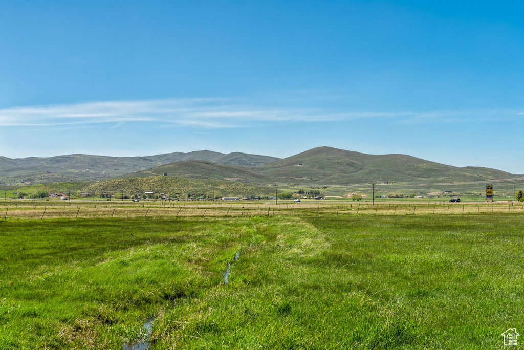 View of mountain background featuring rural landscape and agricultural land