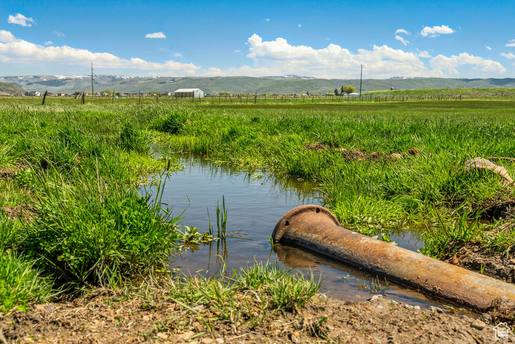 Water view featuring mountains and rural landscape