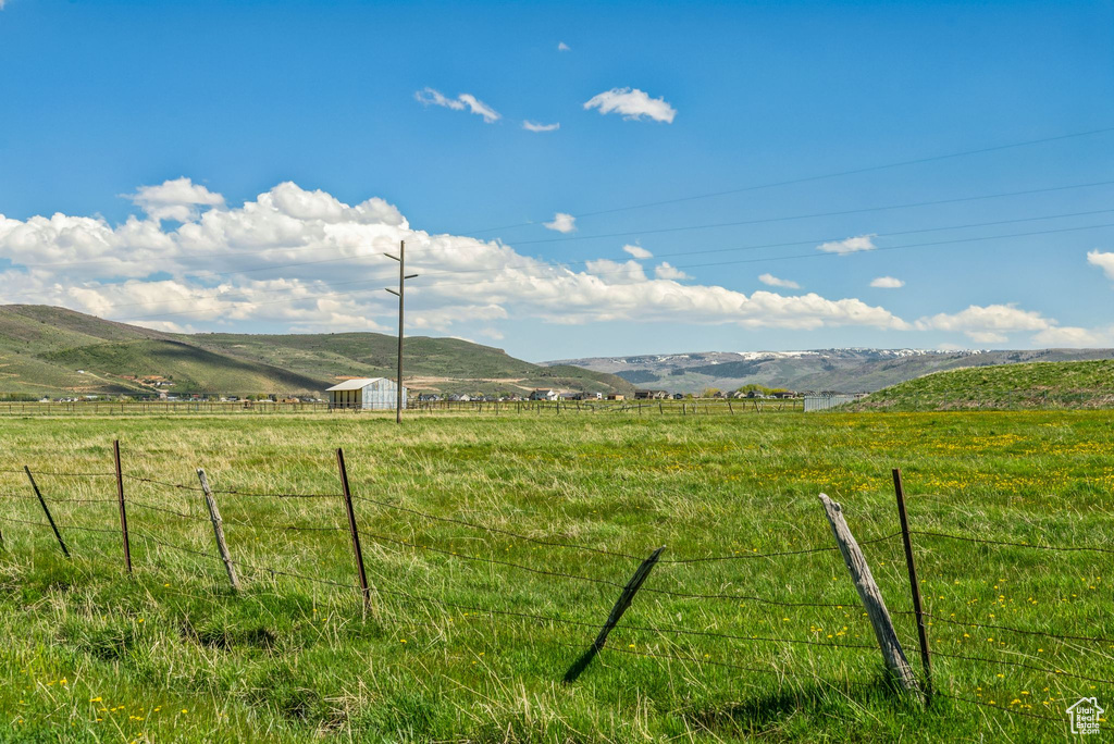 View of mountain background with rural landscape and agricultural land