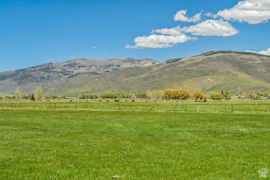 View of mountain backdrop featuring rural landscape and a pastoral area