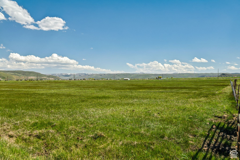 View of yard featuring a view of countryside and a mountain view