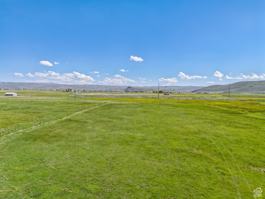 View of yard featuring a view of countryside and a mountain view