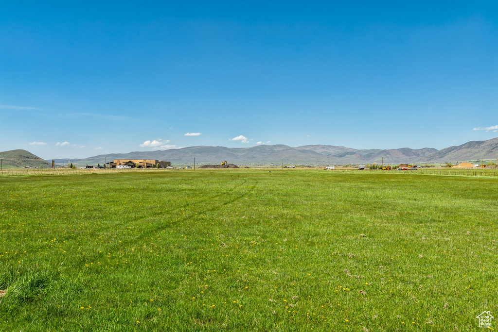 View of mountain background with rural landscape and agricultural land