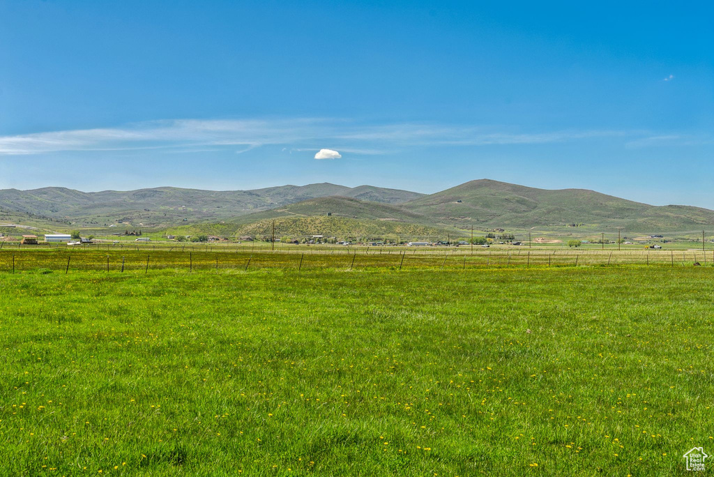 View of mountain backdrop featuring rural landscape and a pastoral area