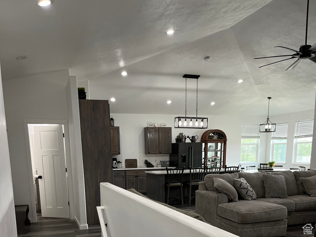 Living area with ceiling fan, dark wood-style floors, and recessed lighting