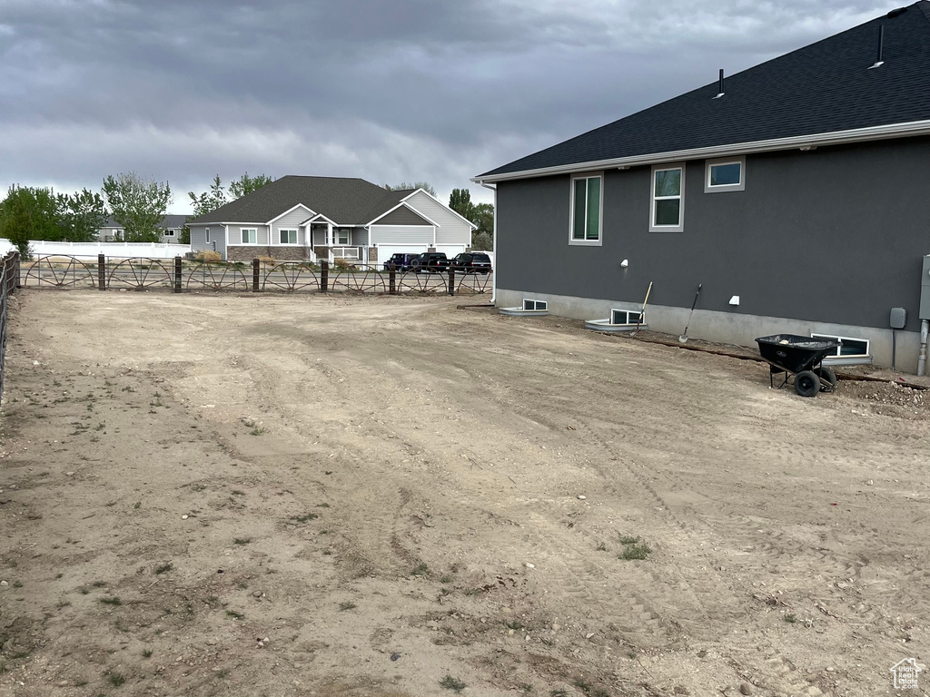 View of yard featuring fence