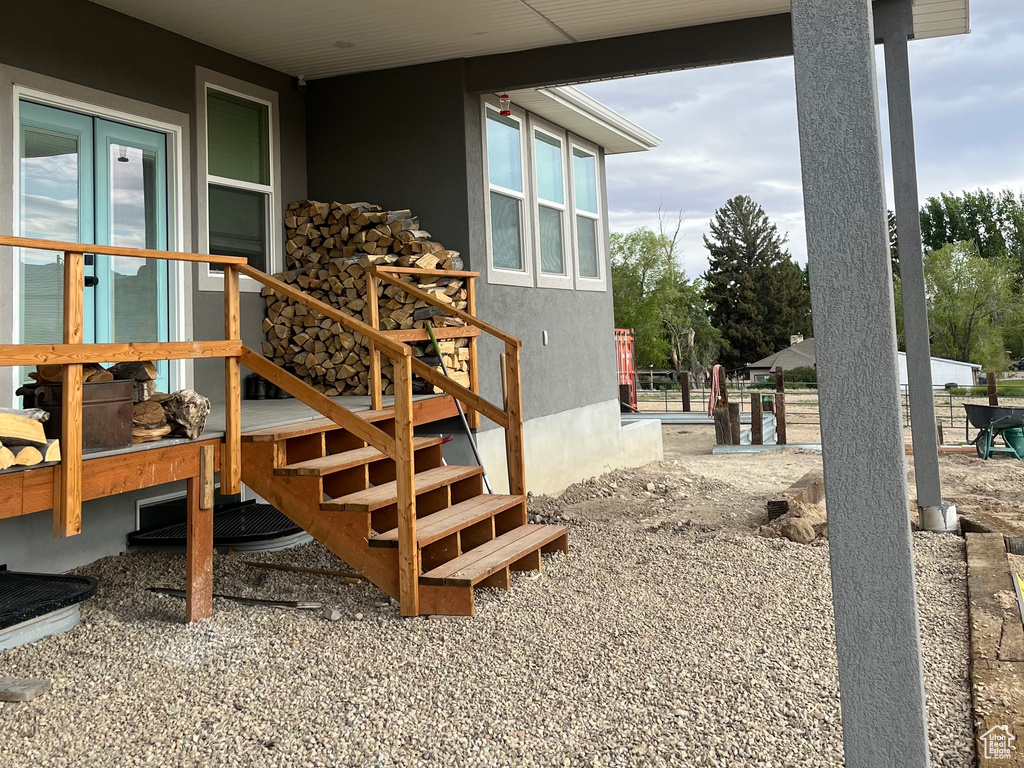 Property entrance featuring stucco siding