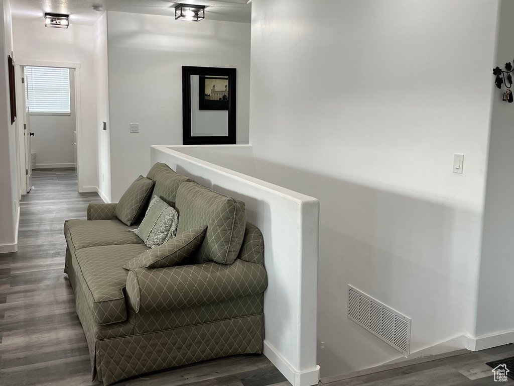 Corridor featuring wood finished floors and baseboards