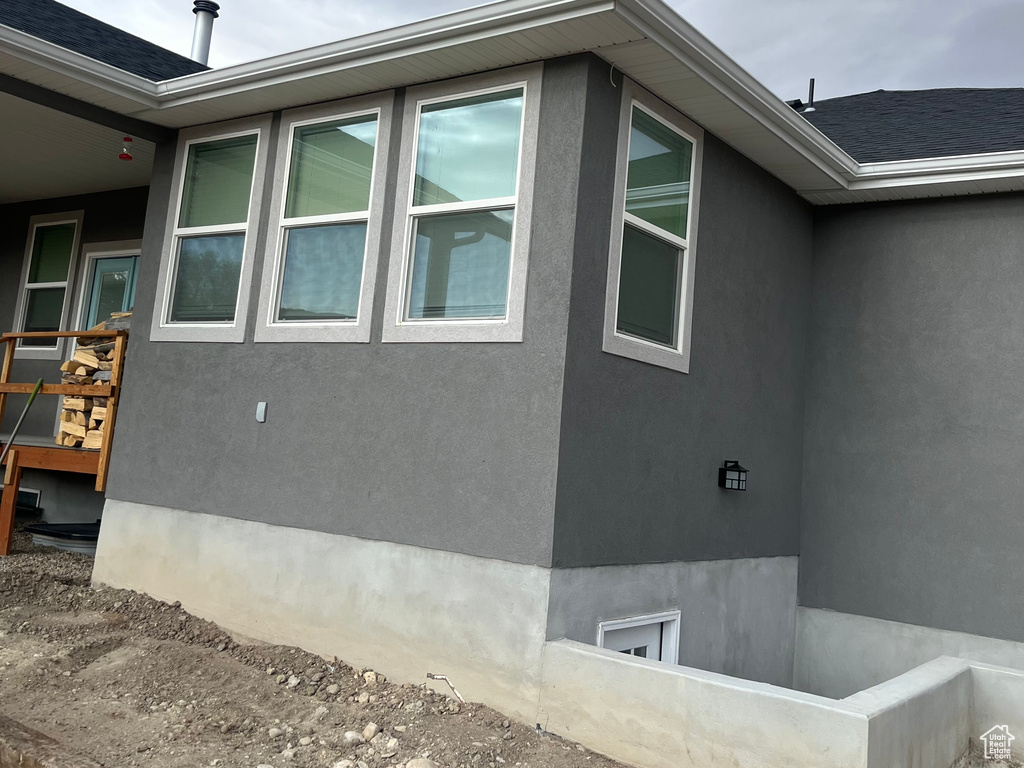View of property exterior with stucco siding