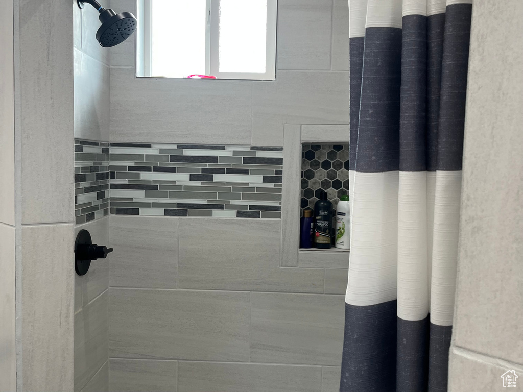 Bathroom with tiled shower