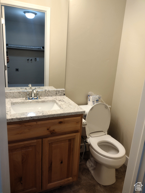 Half bath with vanity and toilet