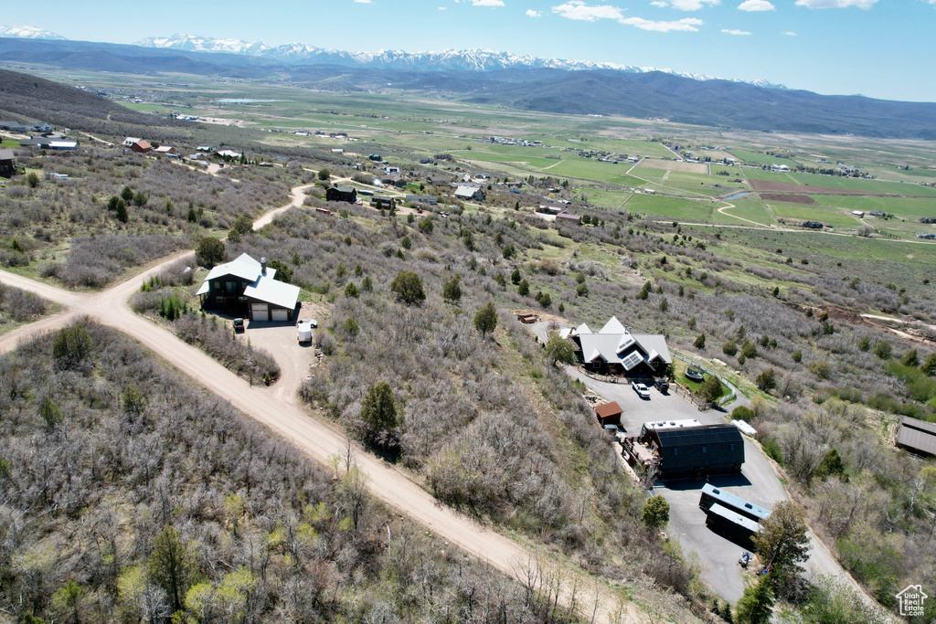 Aerial view of sparsely populated area featuring a mountainous background