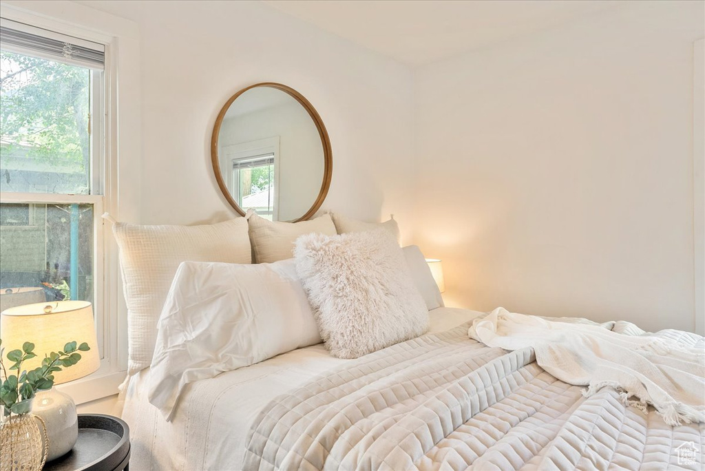 Bedroom featuring multiple windows