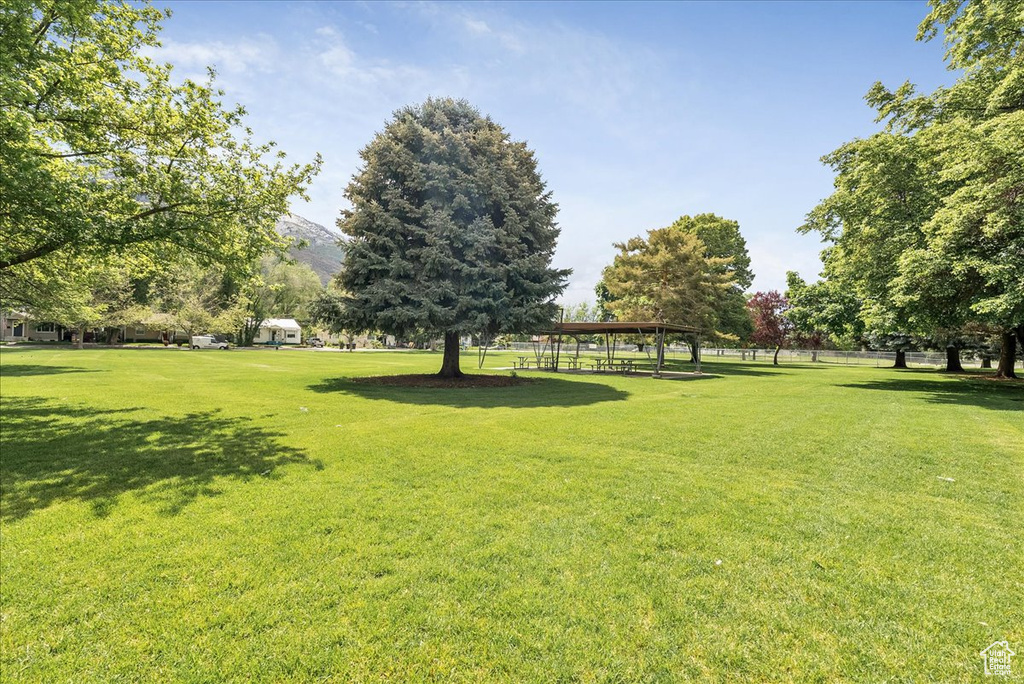 View of home's community with a gazebo, a yard, and a mountain view