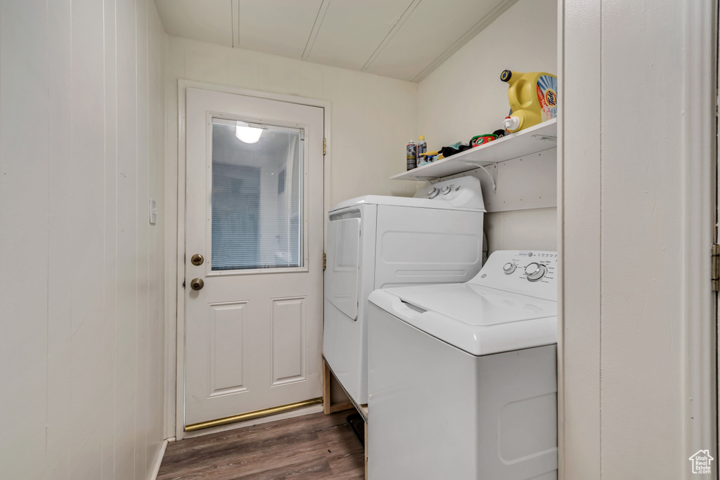 Washroom featuring independent washer and dryer and dark wood-style floors