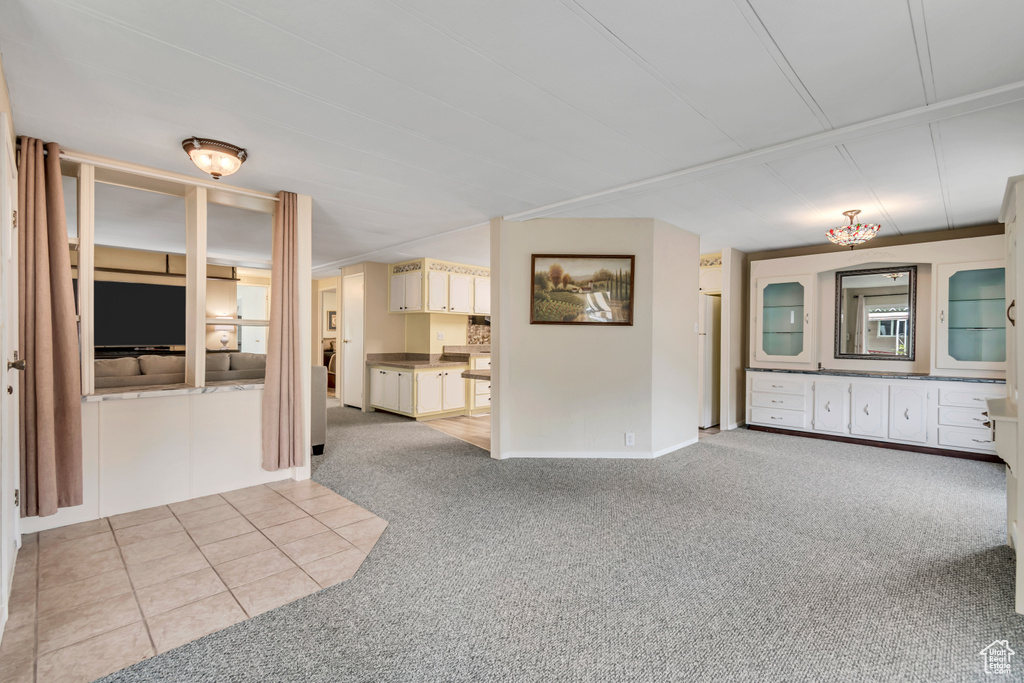 Unfurnished room with light colored carpet