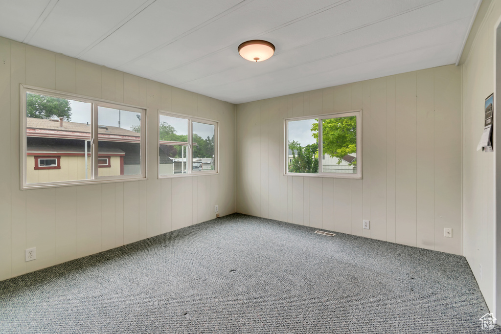 Carpeted empty room with plenty of natural light