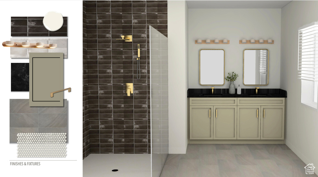 Bathroom featuring a tile shower and double vanity