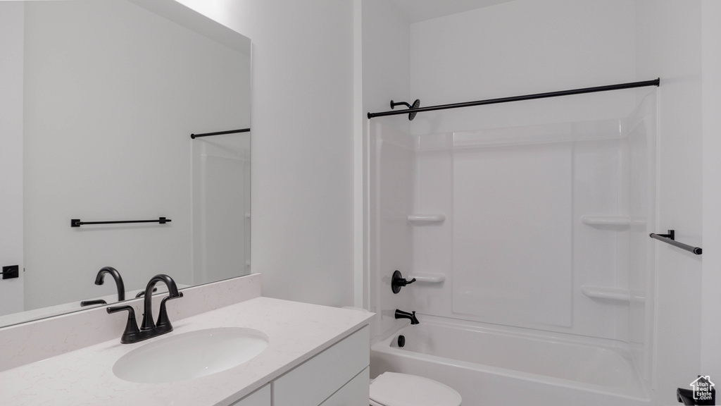 Bathroom with vanity and shower / bathtub combination