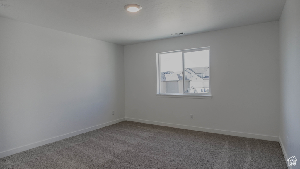 Spare room with carpet flooring and baseboards