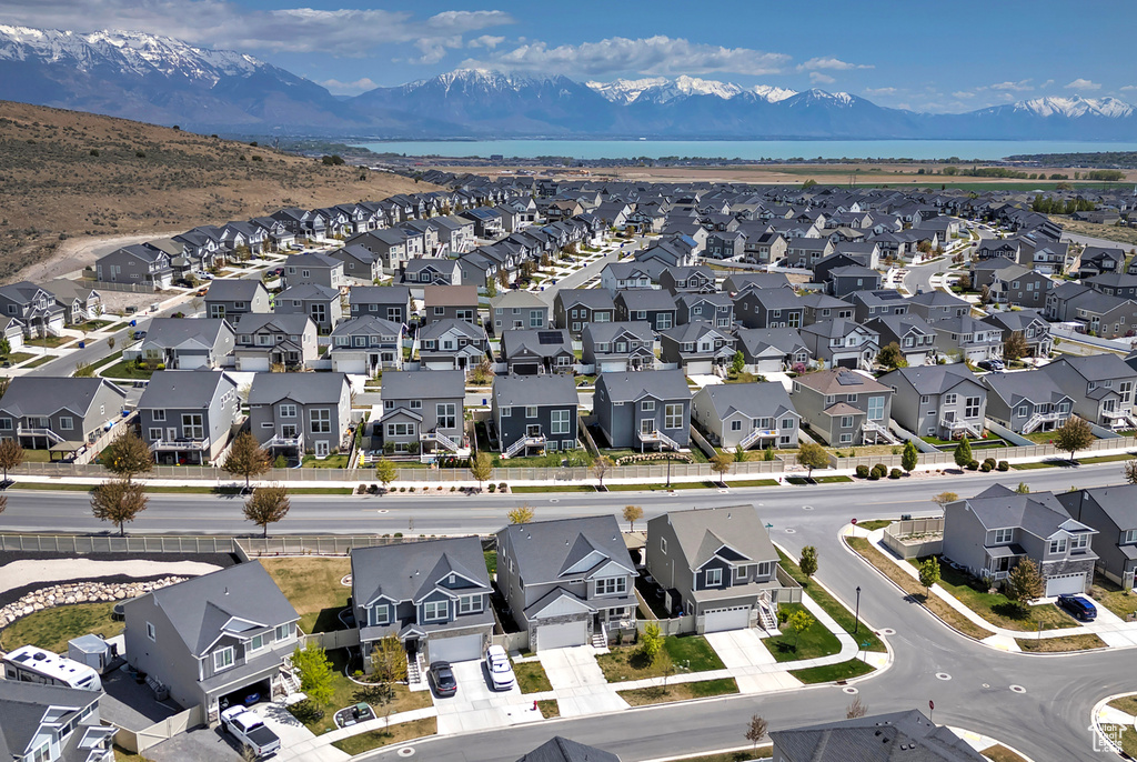 Aerial view featuring a water and mountain view and a residential view