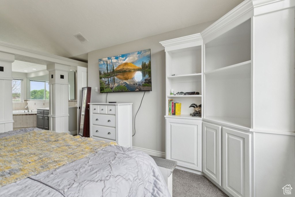 Bedroom featuring baseboards and ensuite bathroom