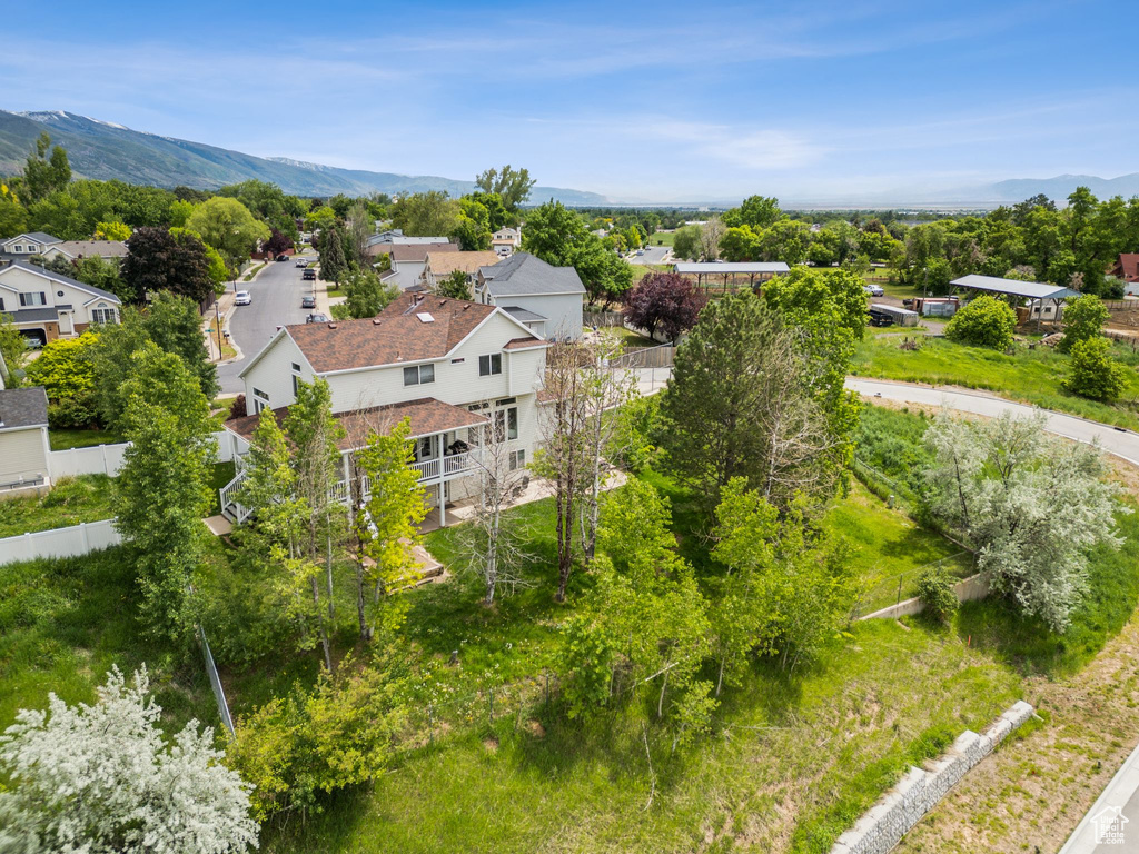 Aerial view of residential area featuring a mountain backdrop