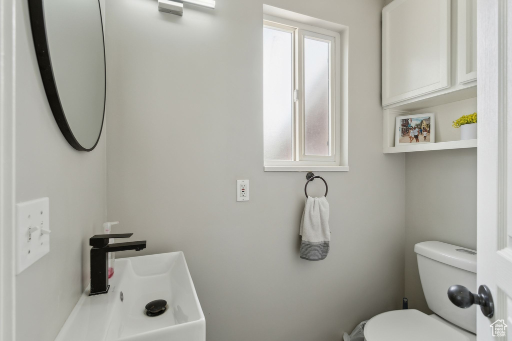 Half bathroom featuring toilet