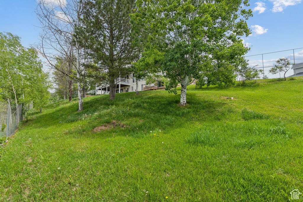 View of yard featuring fence