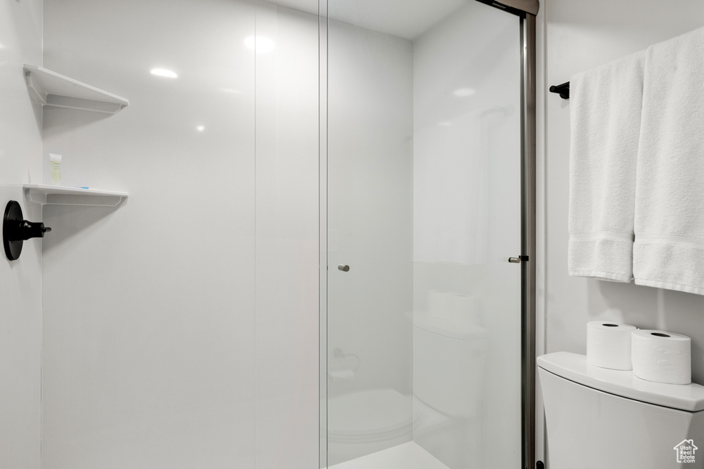 Bathroom with toilet and a shower stall