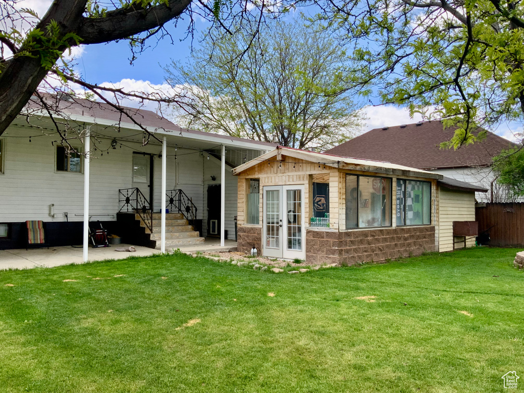 Back of house with french doors