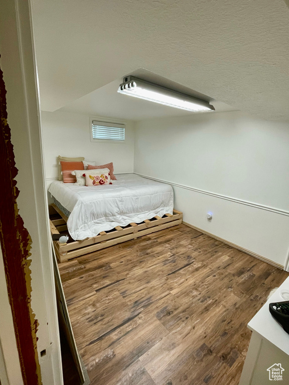 Bedroom with wood finished floors