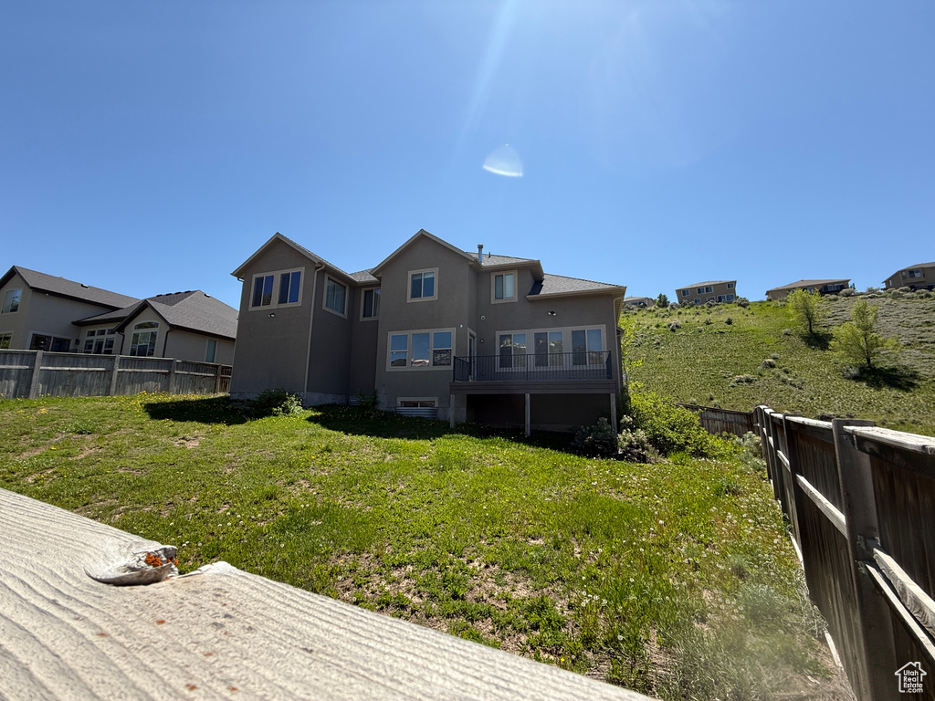 Rear view of property featuring stucco siding
