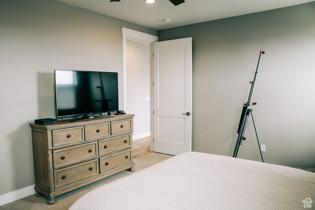 Bedroom with baseboards, light carpet, a ceiling fan, and recessed lighting