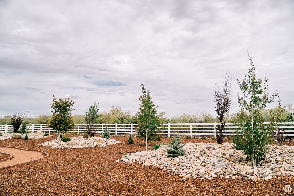 View of yard featuring fence