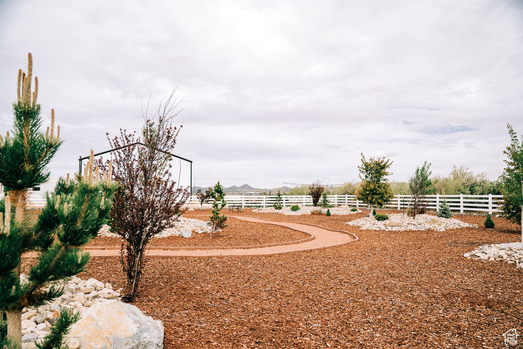 View of yard featuring fence