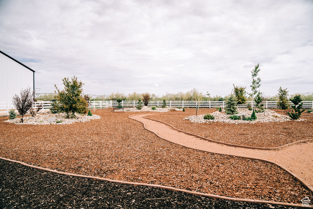 View of yard featuring fence