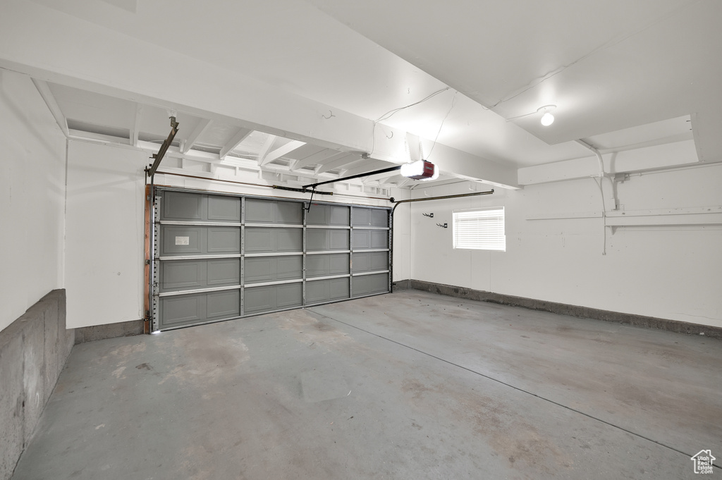 Garage featuring a garage door opener