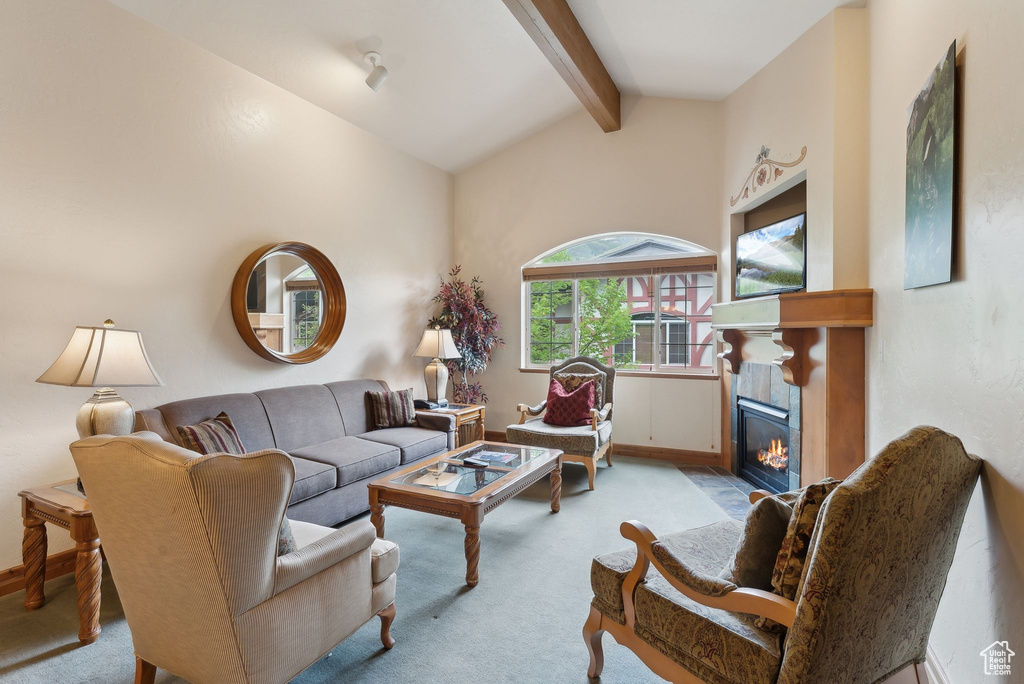 Carpeted living room with a tile fireplace