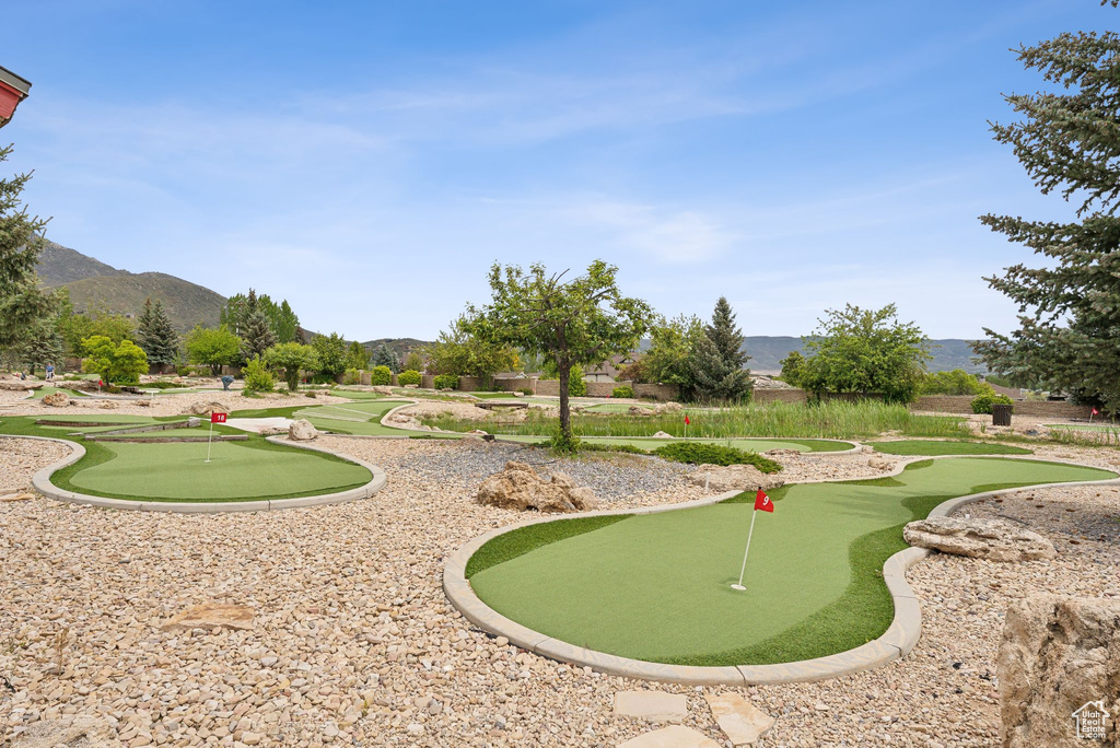 View of property\\\'s community featuring an area to practice putting and a mountain view