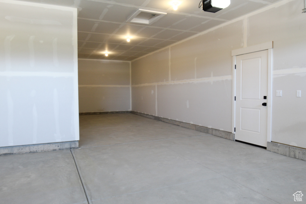 Garage featuring a garage door opener